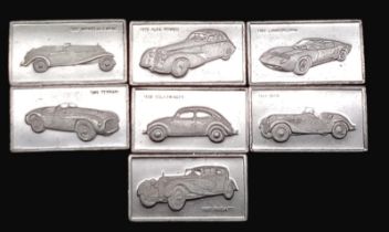 A SELECTION OF 7 STERLING SILVER EUROPEAN CAR MANUFACTURERS MIN CAR PLAQUES WITH LOGO ON ONE SIDE