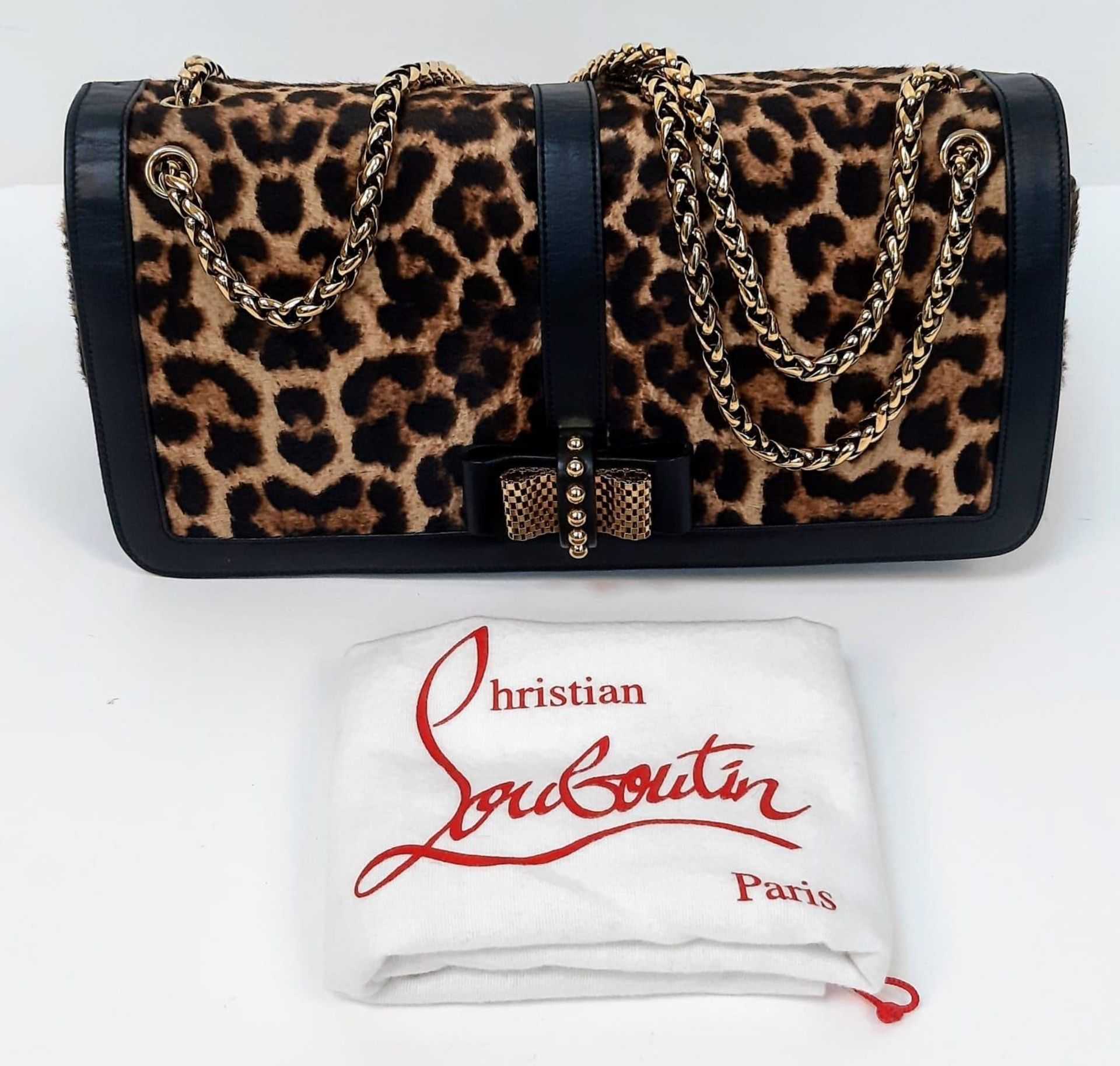 A Christian Louboutin Sweet Charity Leather and Leopard Print Pony Hair Shoulder Bag. Gold tone