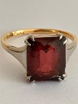 18 carat GOLD and PLATINUM RING Having an Emerald Cut RED TOURMALINE mounted to top. 3.2 grams. Size