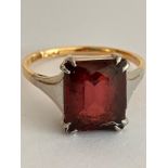 18 carat GOLD and PLATINUM RING Having an Emerald Cut RED TOURMALINE mounted to top. 3.2 grams. Size