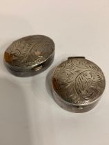 2 x Vintage SILVER PILL BOXES. To include oval and round shapes. Both having decorated lids and full