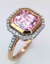 A 9K ROSE GOLD DIAMOND & PINK STONE RING. TOTAL WEIGHT 3G. SIZE N 1/2