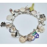 A vintage sterling silver multiple charm bracelet. Total weight 36.3G. Please see photos for more