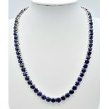 A Blue Sapphire Tennis Necklace on 925 Silver. 46.5cm length, 0.6cm sapphires, 49.4g total weight.