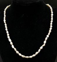 A Vintage Rice Pearl Necklace with 9K Gold Clasp. 56cm length.