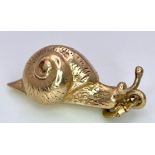 A 9K YELLOW GOLD SNAIL CHARM. TOTAL WEIGHT 0.8G