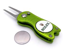 A Rolex Branded 'Flick' Putting Divot Repair Tool. Removable magnetic ball marker. As new. 7cm