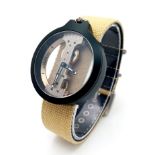A Verticale Mechanical Top Winder Gents Watch. Cream textile strap. Black ceramic gilded skeleton