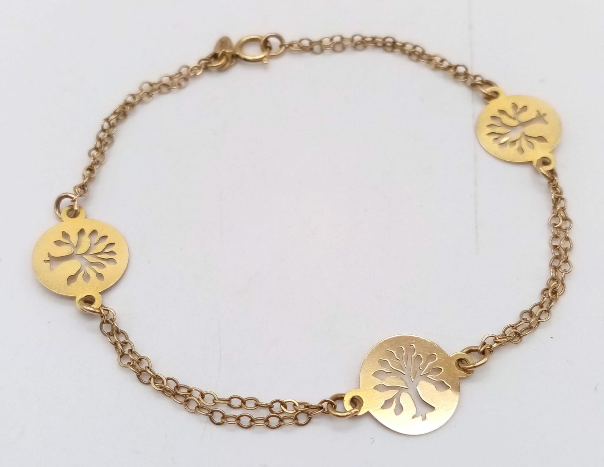 An 18K Yellow Gold Tree of Life Bracelet. 16cm. 2.2g weight.