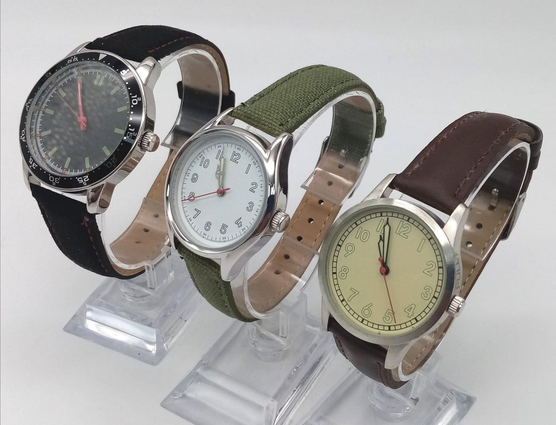 A Parcel of Three Unworn Military Homage Watches Comprising; 1) 1960’s Portuguese Colonial Watch (