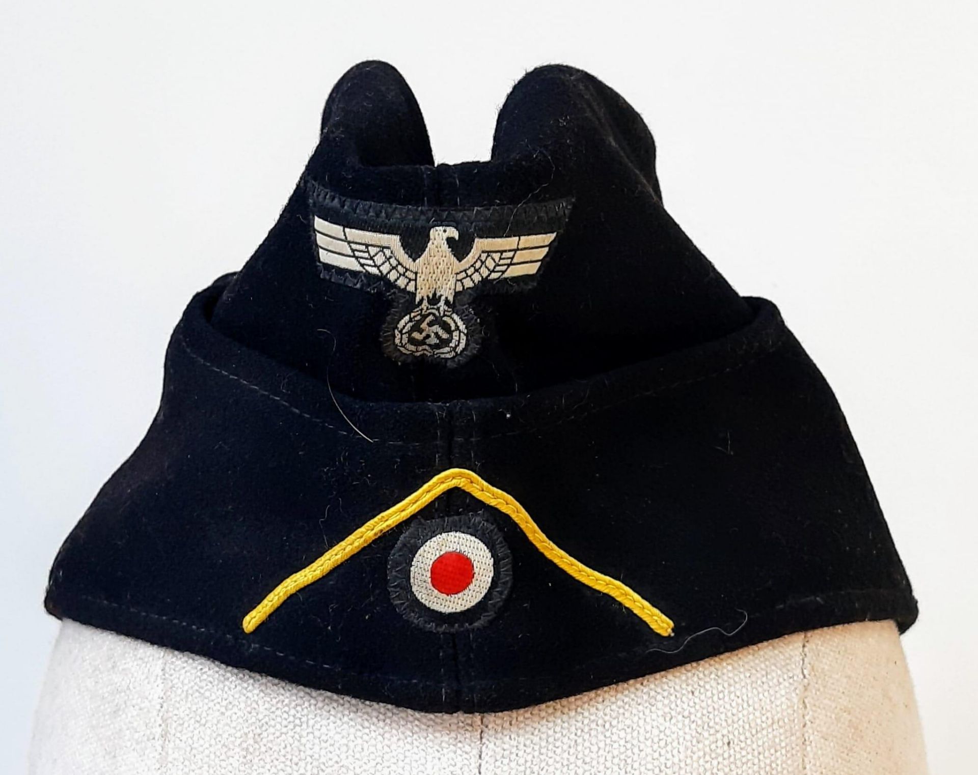 A WW2 German Panzer (Reconnaissance) Side Cap. Makers Name and size inside.
