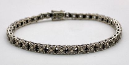An 18K White Gold Diamond Tennis Bracelet. 160 small round cut diamonds - 1.5ctw approx. 18cm