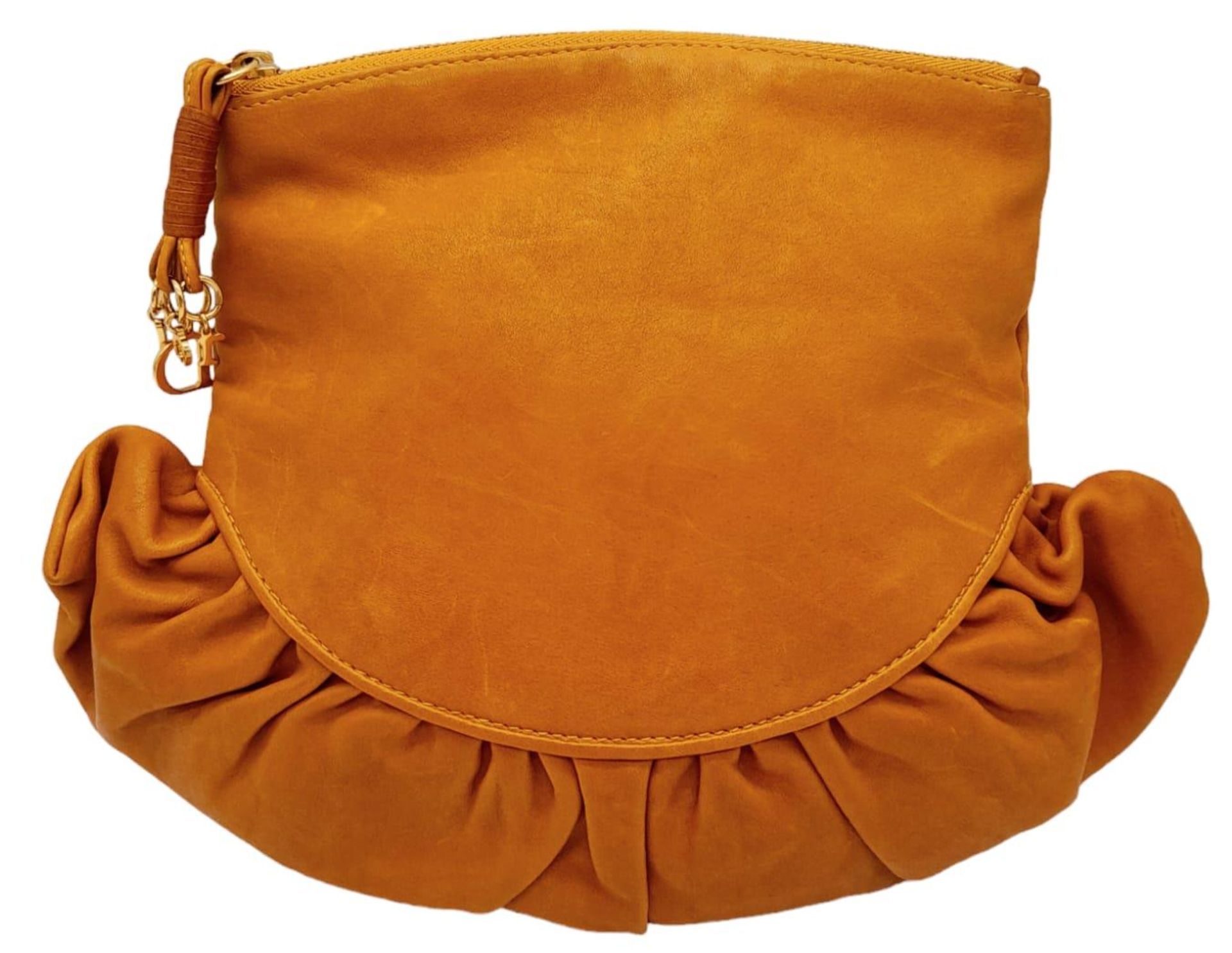 A Christian Dior Caramel Ruffled Clutch Bag. Leather exterior with gold-toned hardware and a