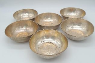 A SET OF 6 800 SILVER ISLAMIC CEREMONIAL DISHES . 12cms DIAMETER 498gms