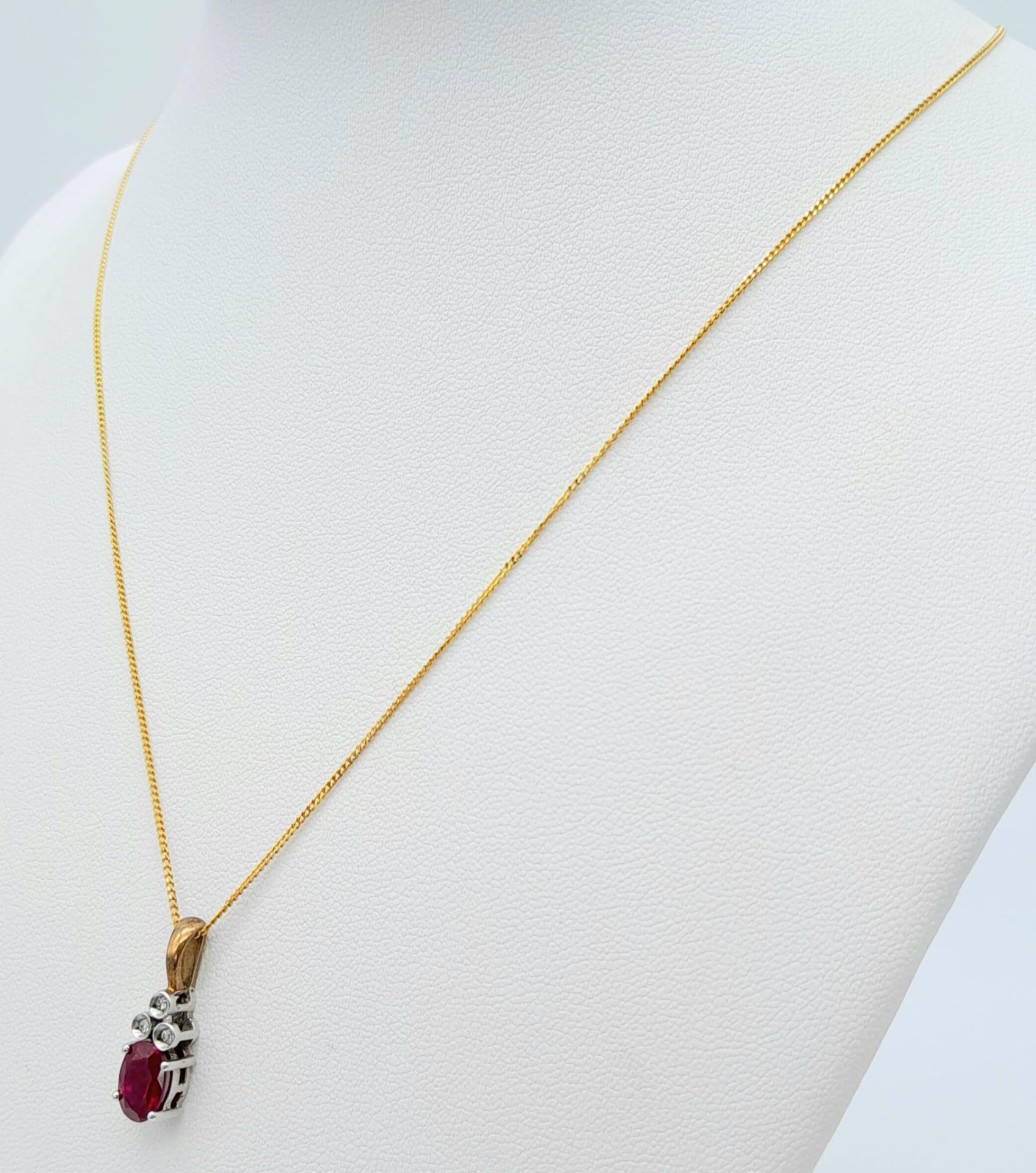 A 9K YELLOW GOLD DIAMOND & RED STONE PENDANT BELIEVED TO BE RUBY & 9K GOLD CHAIN 2.8G , 46cm length. - Image 2 of 6