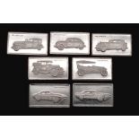 A SELECTION OF 7 STERLING SILVER AMERICAN CAR MANUFACTURERS MINI PLAQUES WITH LOGO AND CARS AND