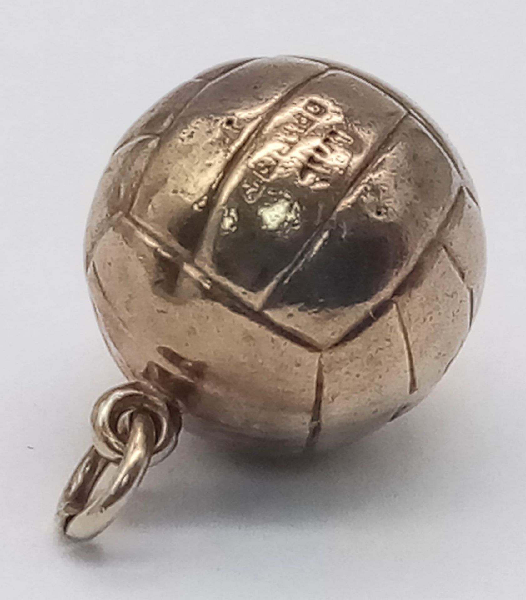 A Vintage 9K Yellow Gold Football Pendant/Charm. 15mm. 0.76g weight.