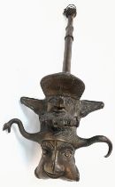 An Antique Bronze Two-Piece Pipe. Gothic, almost Satanic Decorative Base. 66cm length.