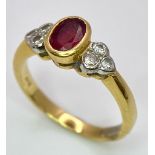 An 18K Yellow Gold Ruby and Diamond Ring. Central oval ruby with six round cut diamond accents. Size