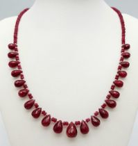 A Ruby Beaded Necklace with Ruby Teardrops and 925 Silver Clasp. 160ctw rubies, 46cm length, 31.