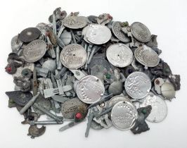 Over 200 + 3rd Reich Winterhilf Fund Raising Badges. They all have either pins or stones missing