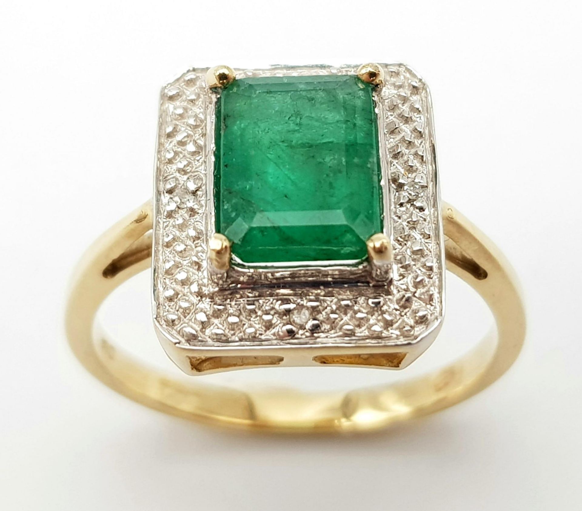 A 9K GOLD RING WITH 2.5ct NATURAL EMERALD SURROUNDED BY DIAMONDS. 3.8gms size O - Image 2 of 5