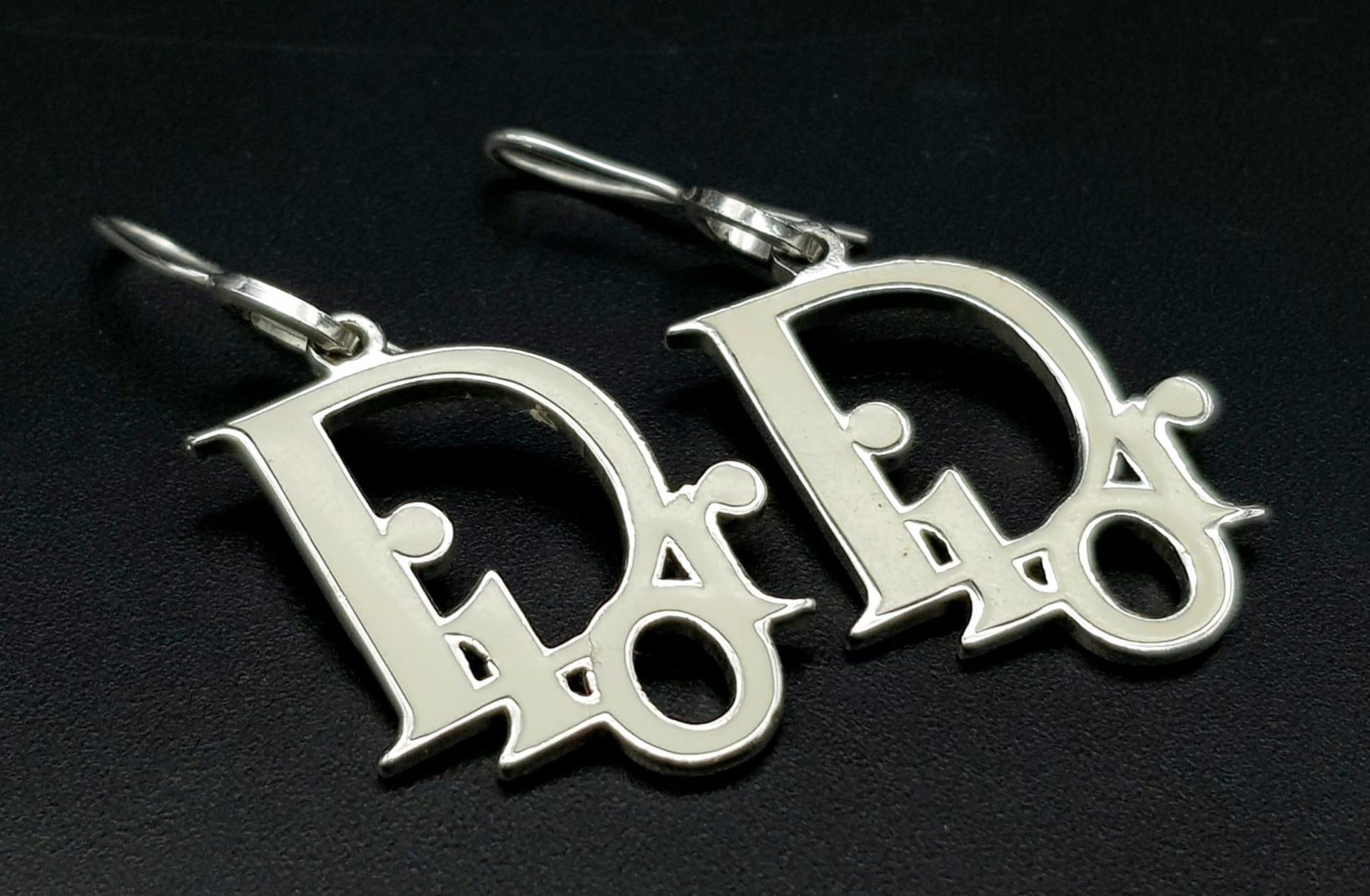 A Pair of Christian Dior White Enamel Earrings. Logo drop -3cm. Ref: 104270