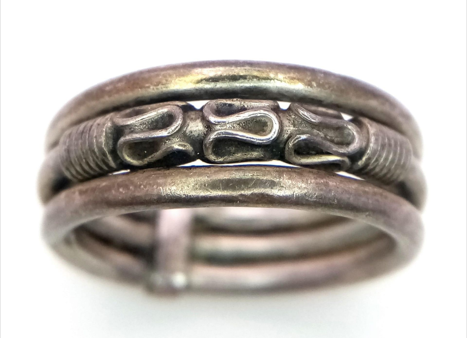 A vintage 925 silver rope designed triple band ring. Total weight 3.8G. Size N.