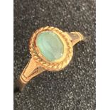 9 carat GOLD RING with Oval Cut BLUE TOPAZ set to top. Attractive GOLD ROPE Surround. Full UK