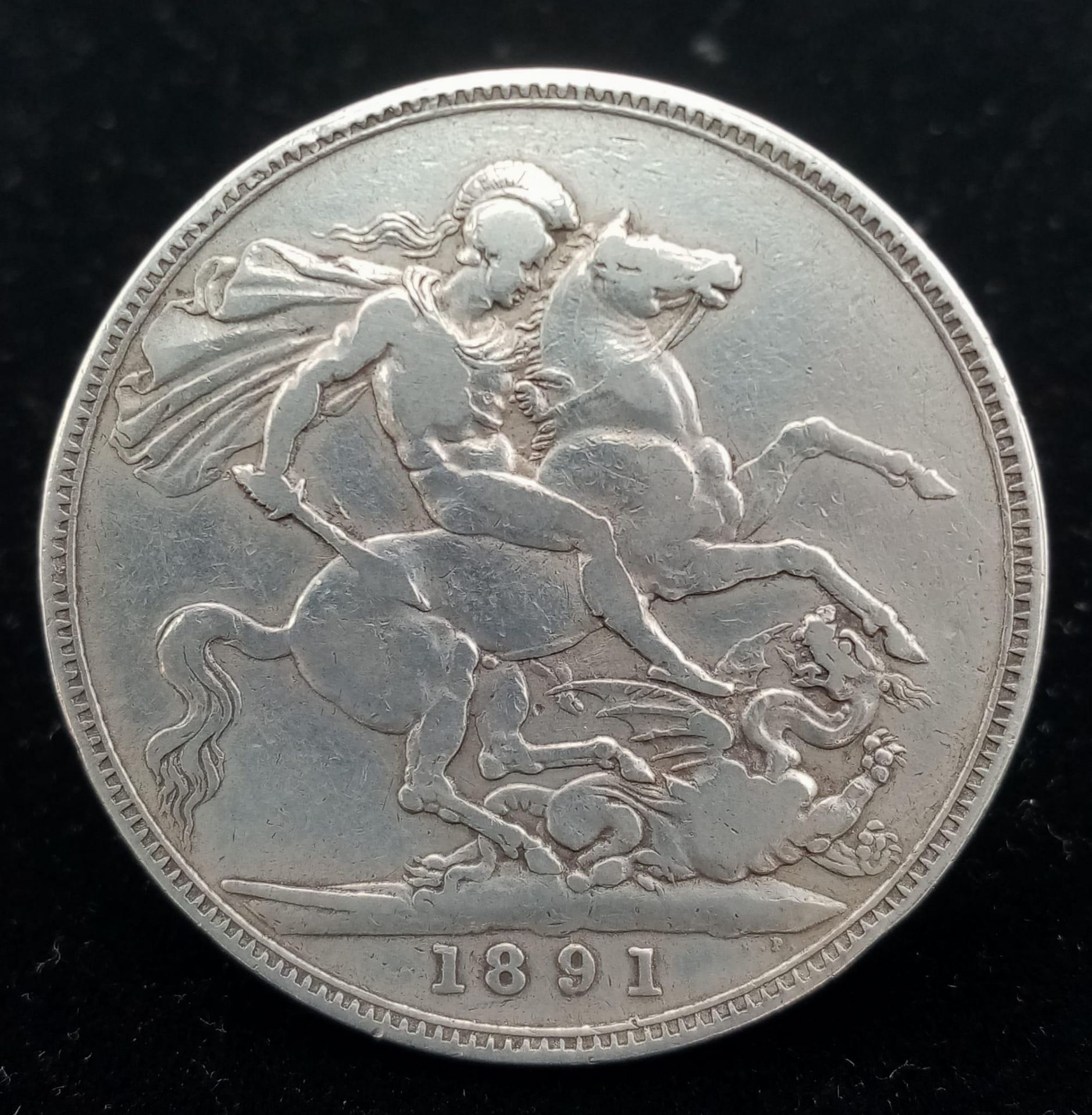 An 1891 Queen Victoria Silver Crown. VF grade but please see photos.