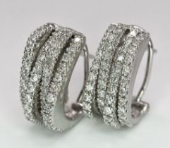 A PAIR OF 18K WHITE GOLD DIAMOND EARRINGS. TOTAL WEIGHT 9.8G