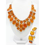 A majestic amber necklace and bracelet set, in a presentation case, Necklace length: 52 cm (max)