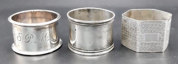 A collection of 3 antique sterling silver napkin holders: 2 circular come with full Birmingham