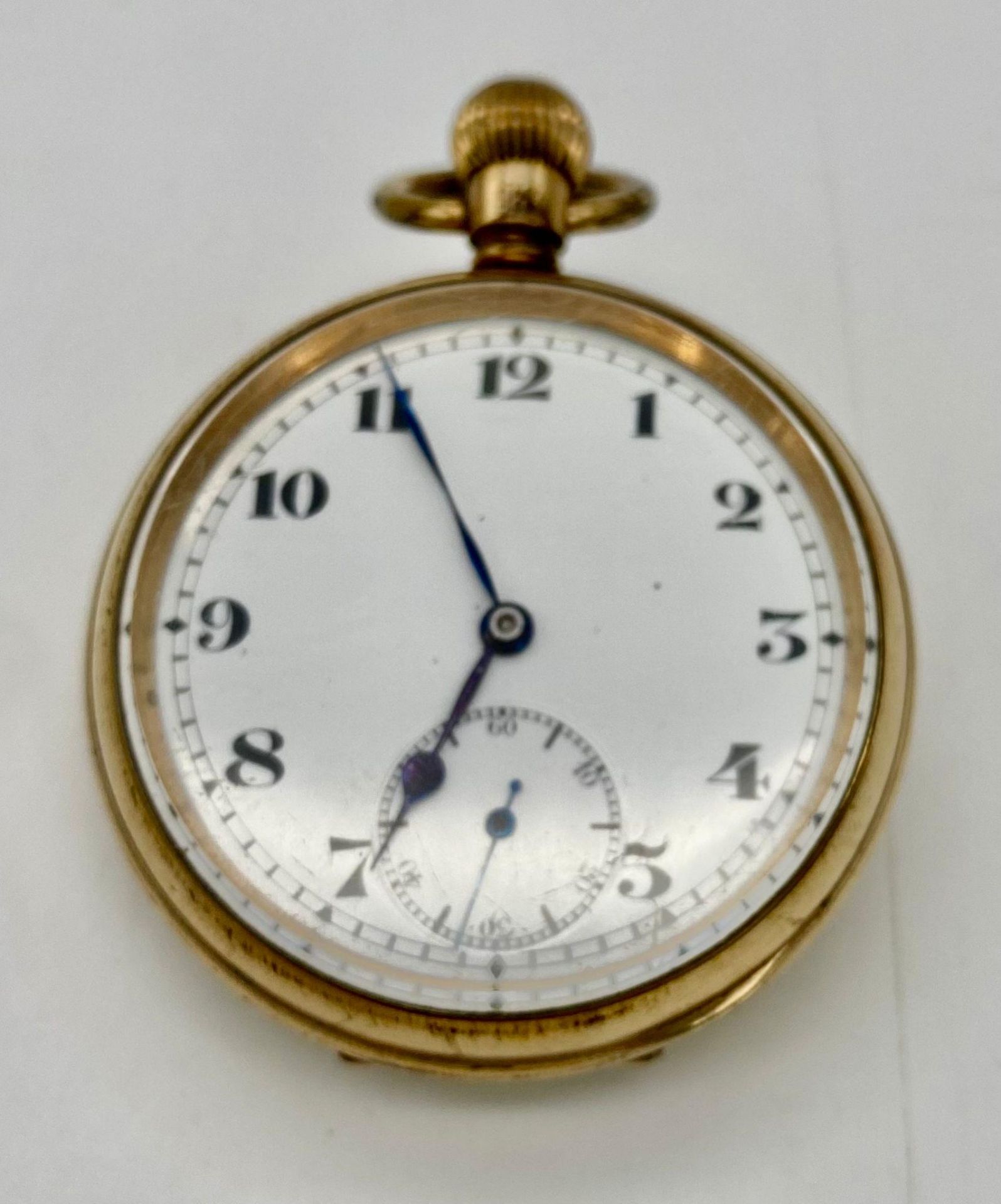 An Antique Gold Plated Record Watch Company Pocket Watch. 7 jewels. Top Winder. White dial with