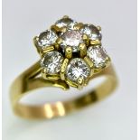 A Gorgeous 18K Yellow Gold Diamond Floral Ring. Seven brilliant round cut diamonds create the