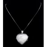 A vintage sterling silver heart locket pendant on 24K gold plated chain. Total weight 10G. Total