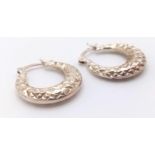 A fancy pair of 925 silver hoop earrings. Total weight 2.95G. Please see photos for details.