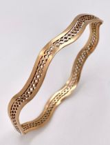 A Vintage 9K Rose Gold Undulating Large Bangle. Pierced geometric decoration. 17.6g weight.