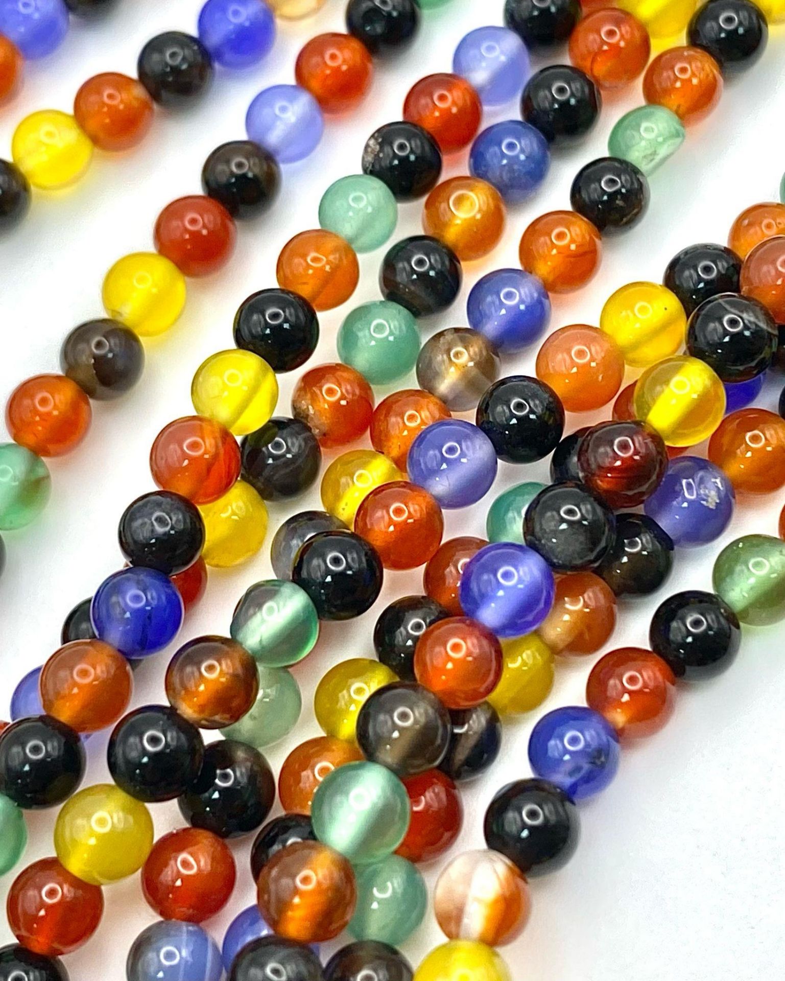 A very interesting necklace consisting of three very long (125 cm) strands of multicoloured beads - Image 5 of 5