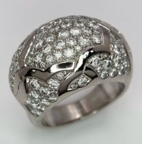 A Chanel, Designer 18K White Gold Diamond Encrusted Ring. This head-turning piece has