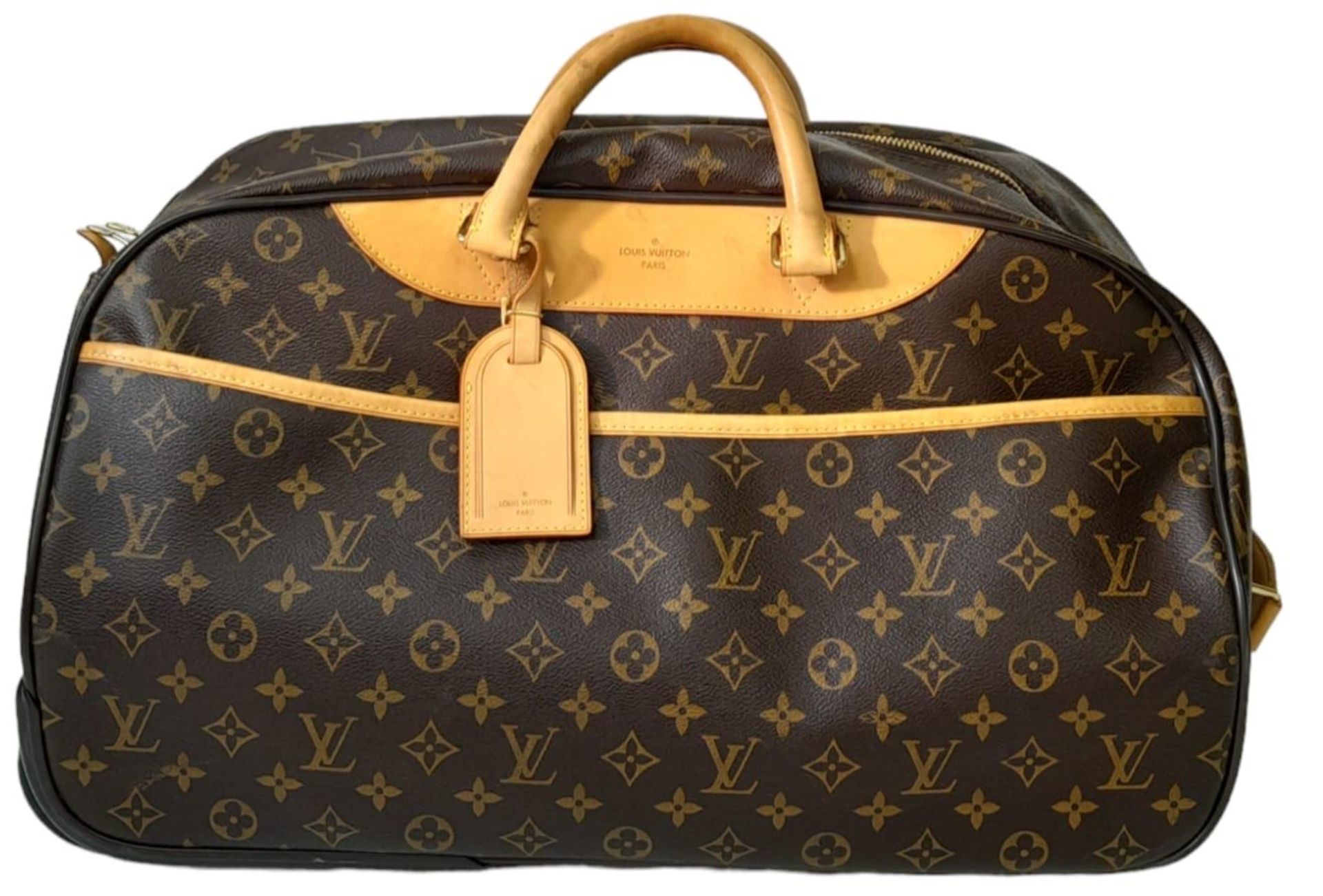 A Louis Vuitton Monogram Eole Convertible Travel Bag. Leather exterior with gold-toned hardware,