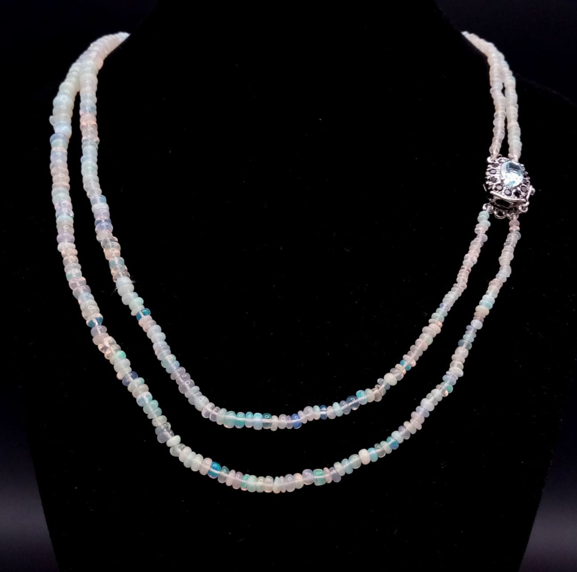 An Ethiopian Opal 2 Strand Necklace with an Aquamarine 925 Silver Pendant Clasp. Small colour-play