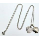 A vintage sterling silver necklace with 2 silver heart locket pendants. Total weight 5.6G. Total