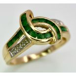 A 14K GOLD DIAMOND AND EMERALD RING . 3.3gms size O