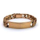A CHUNKY 9K GOLD I.D. BRACELET WITH BARK EFFECT LINKS AND SAFETY CHAIN . 59.2gms