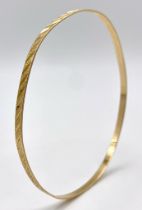 A Vintage 9K Yellow Gold Bangle. 3.75g weight. 6.5cm inner diameter.