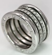 A Bulgari Designer 18K White Gold Diamond Ring. This B.Zero 1 ring has three rows of 1.2ctw