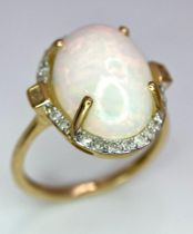 9K Yellow Gold 4,14 ct cabochon Opal ring with halo Diamonds, weight 3g, size L