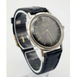 A Vintage Favre-Leuba Mechanical Gents Watch. Black leather strap. Thin stainless steel case - 33mm.