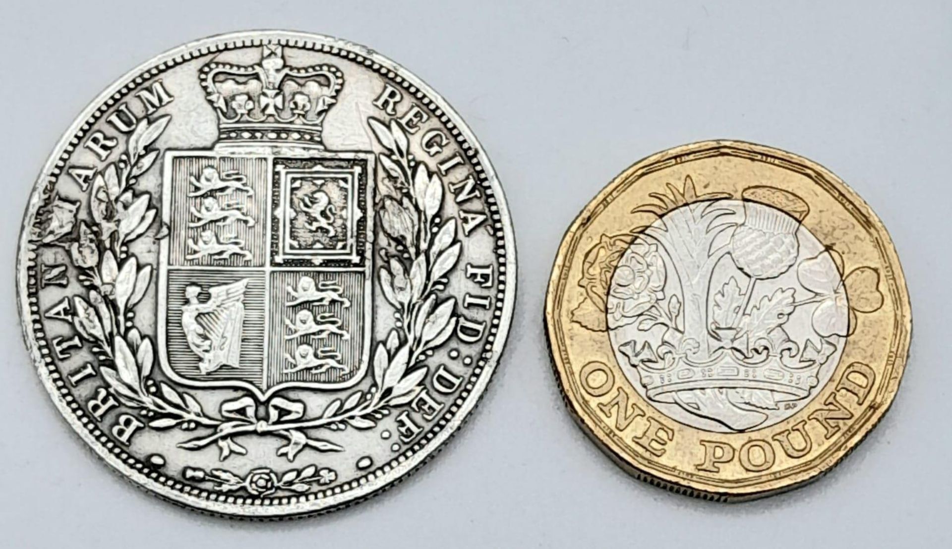 An 1883 Queen Victoria Silver Half Crown. Unfortunately some surface damage on obverse. - Image 2 of 3